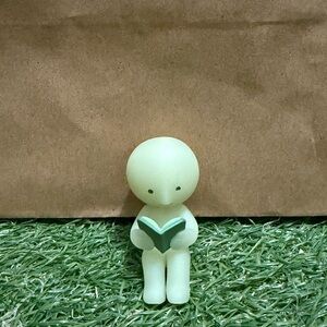 SMISKI Authentic Glow-in-the-Dark Figurine with Book